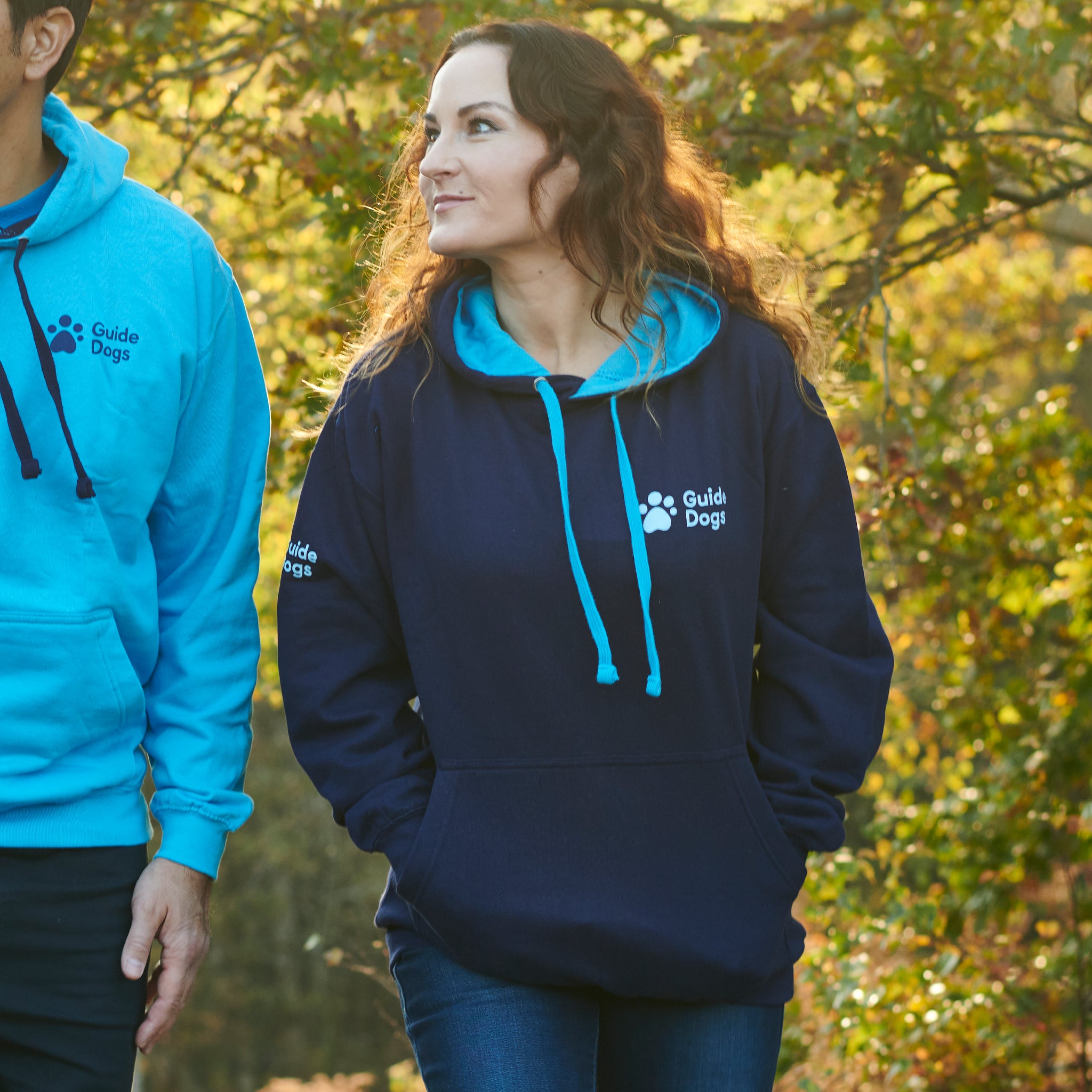 Navy hoodie with Guide Dogs logo and illustration