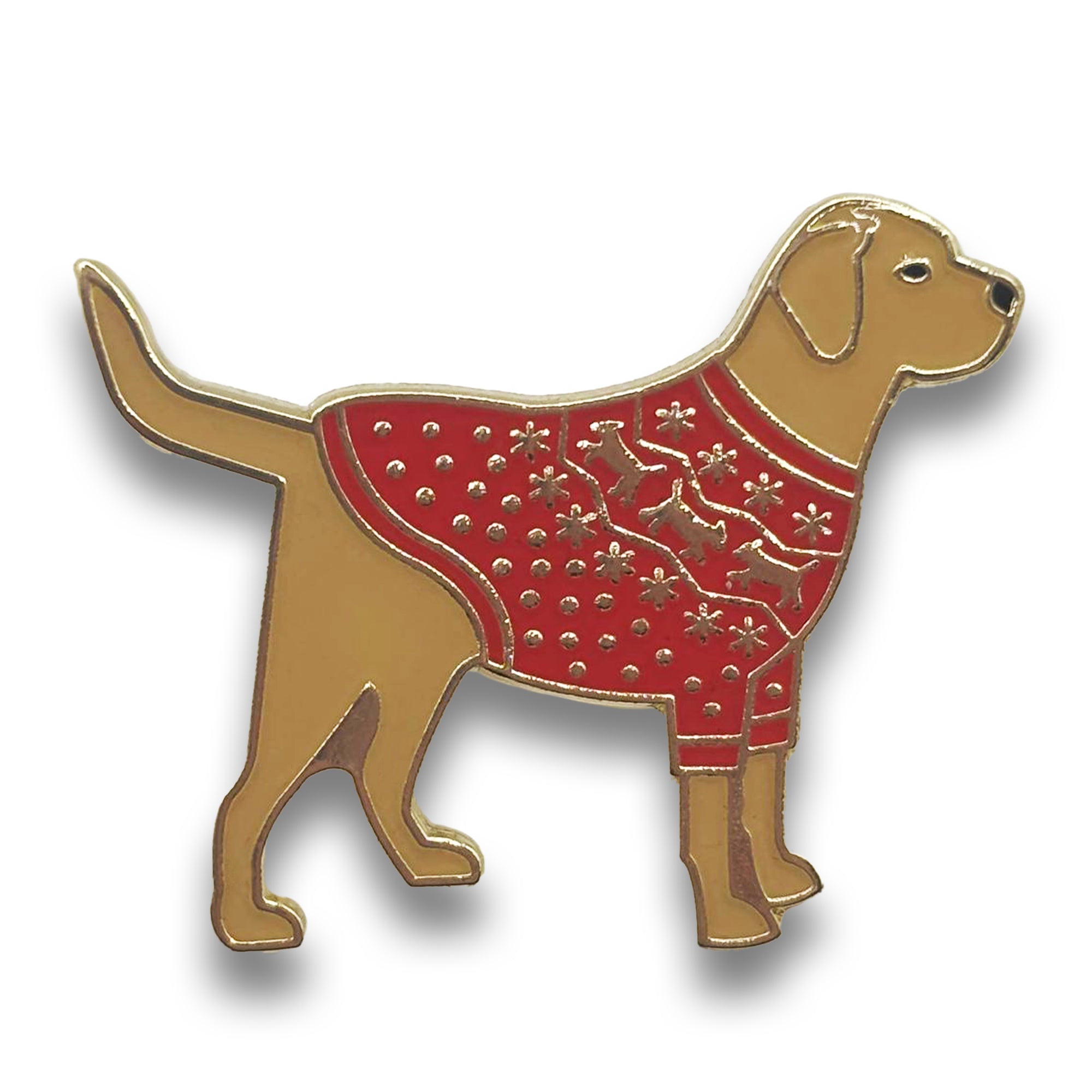 A pin badge featuring a golden Labrador wearing a red Christmas jumper.