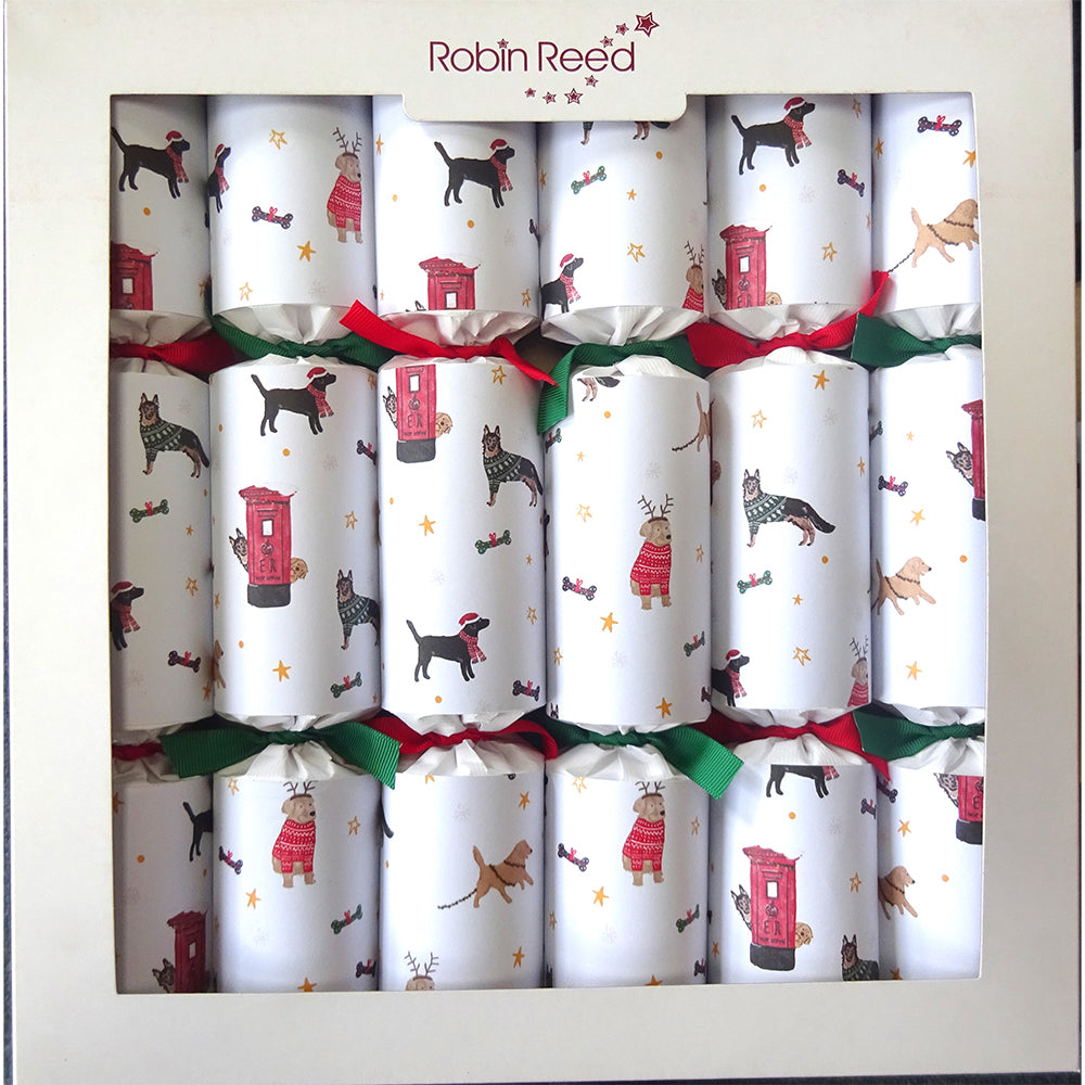 A box of 6 Christmas crackers, all with Christmas dogs pattern and red and green ribbons