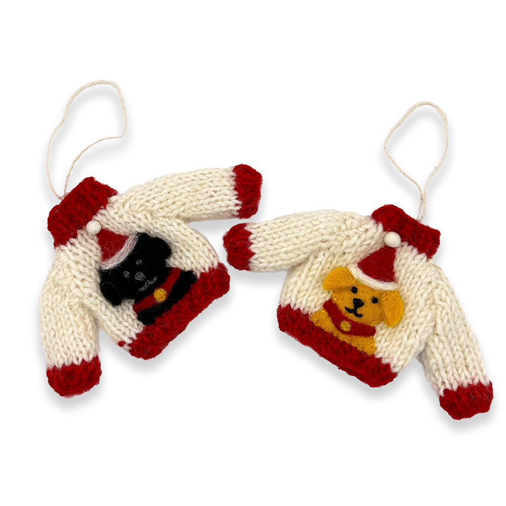 Two knitted Christmas jumper decorations, one featuring a black Labrador, the other a golden Labrador. Both jumpers are white with red edges and the Labradors are wearing a Santa hat.