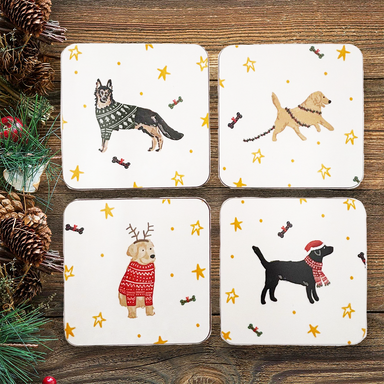 Four coasters on a wooden background. Each coaster features a different festive dog: German Shepherd, Yellow Labrador, Golden Retriever and Black Labrador.