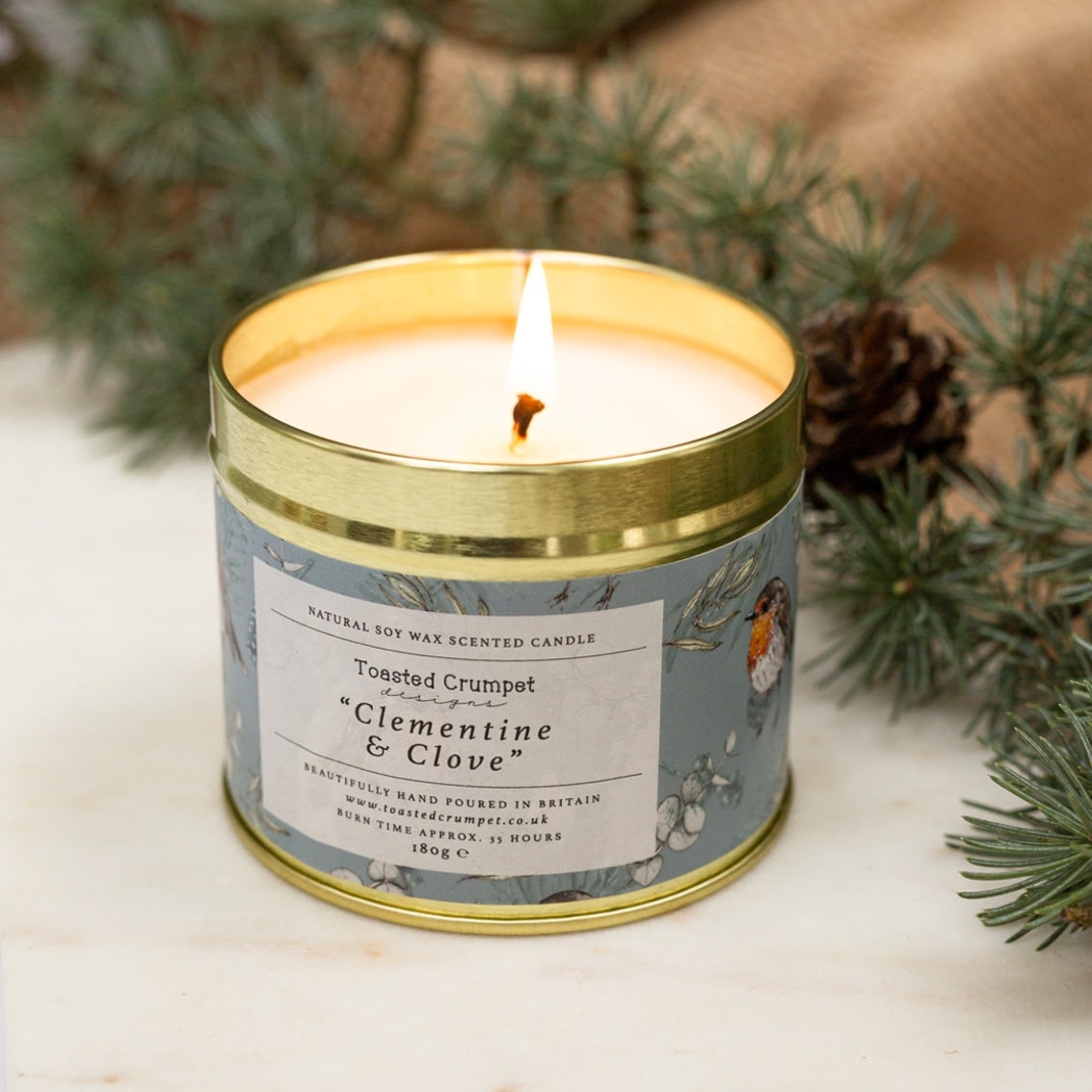 Clementine and clove scented candle