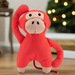 A red dog toy in the shape of a monkey.