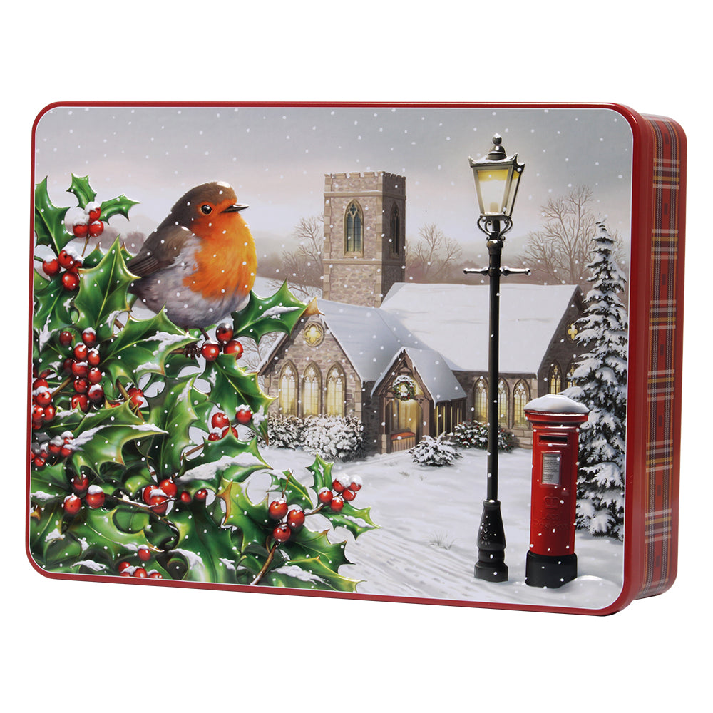 A photograph of a tin of biscuits featuring a robin and a church on a snowy day.