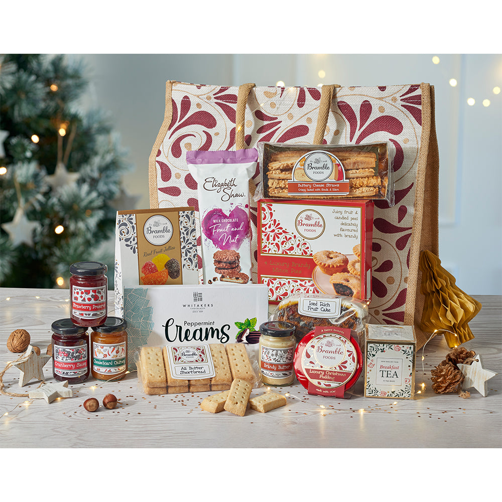 A photograph of a tote bag with swirl pattern with lots of festive food.