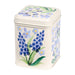 A cream tin with wildflower pattern.