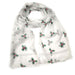 A white looped scarf printed with green holly sprigs and red berries