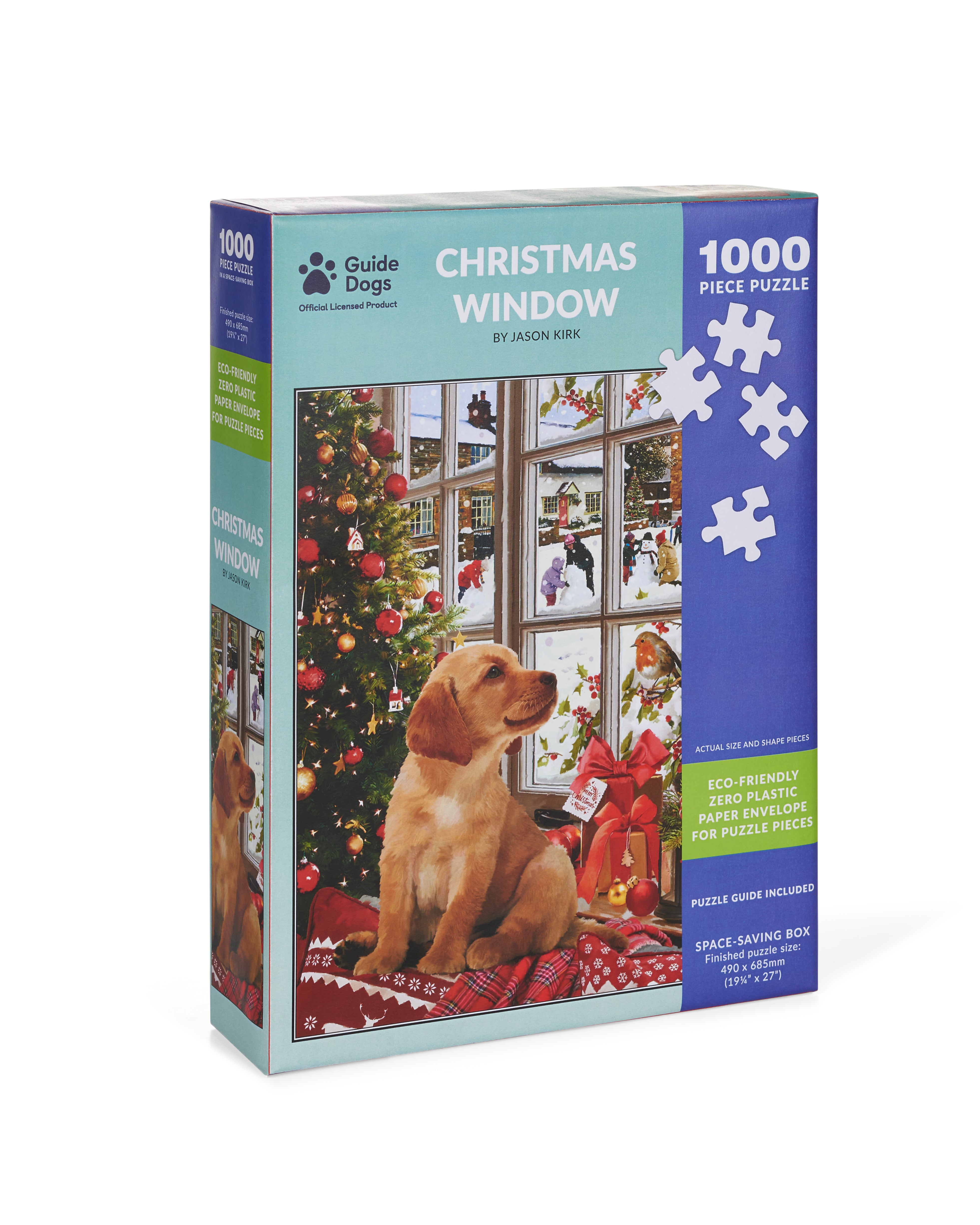 Guide Dogs  jigsaw box showing illustration of Labrador puppy looking out of a window onto a snowy scene