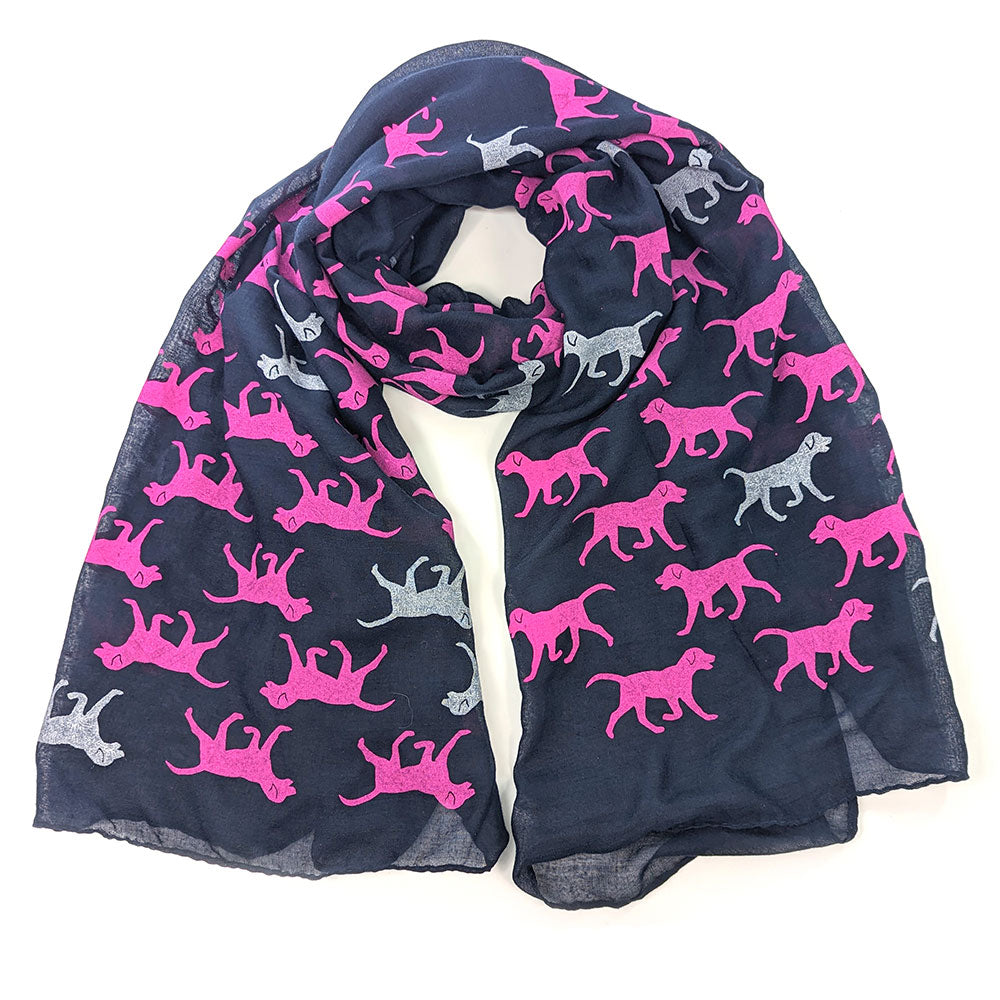 A looped navy blue scarf with pink and white dogs pattern