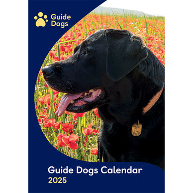 Front cover for the Guide Dogs 2025 Wall Calendar featuring a Black Labrador sitting in a field of poppies.