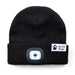 Black woollen beanie hat with LED light and Guide Dogs logo label