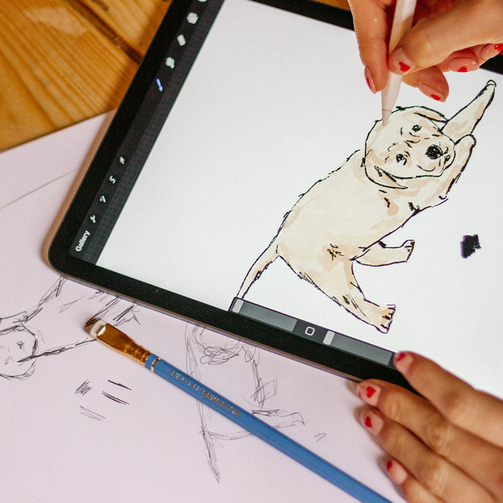 Laura Fisher sketching the puppy design on a tablet