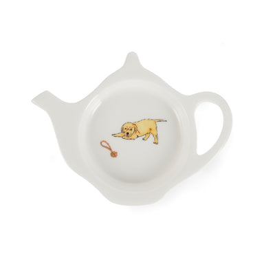 A white china teabag tidy in the shape of a teapot, with Labrador puppy and rope toy design