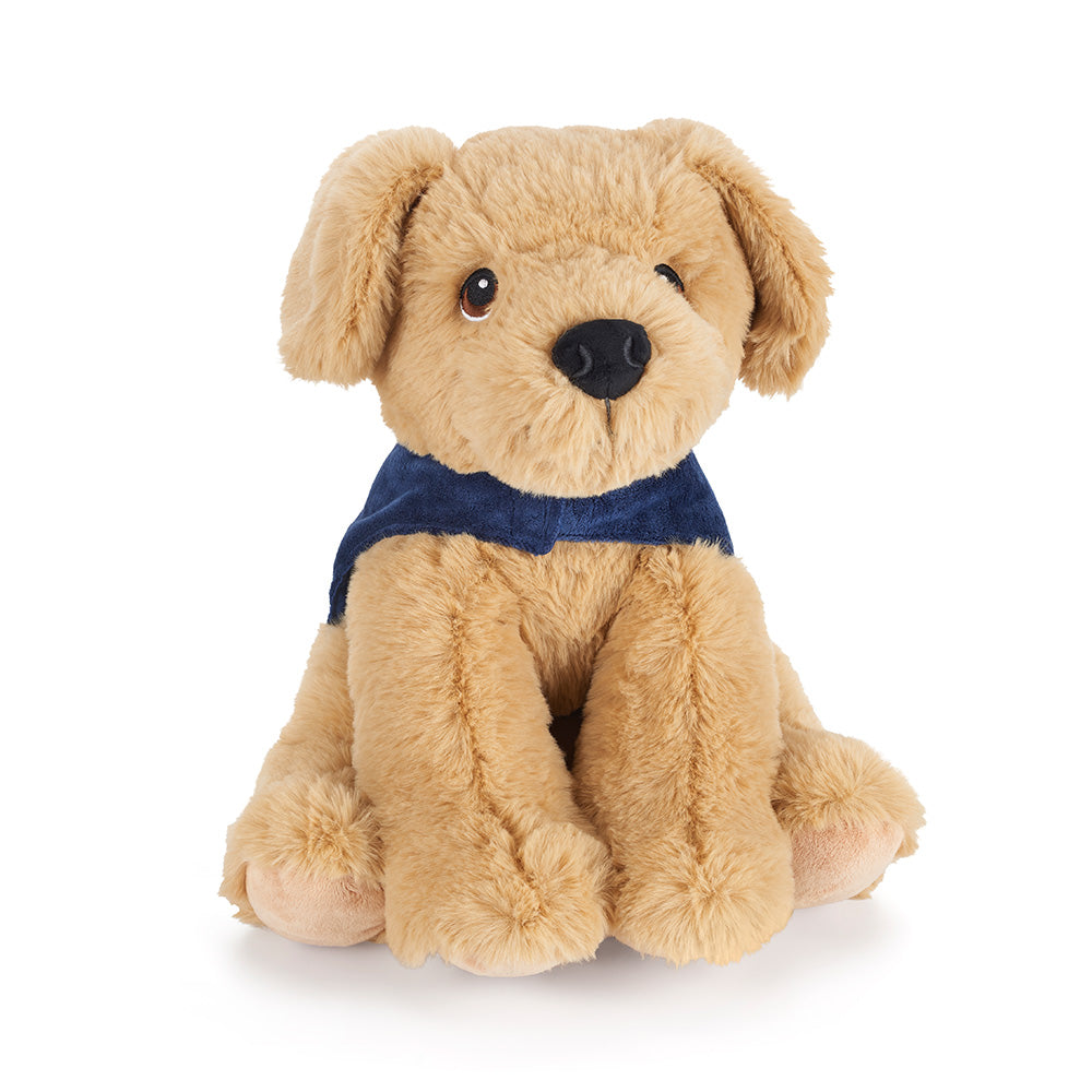 A close up of a yellow Labrador cuddly toy with a blue Guide Dogs coat on.