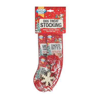 A Christmas stocking shaped net containing festive treats including dog snacks and toys.