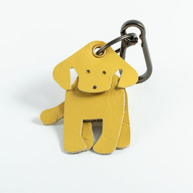 A yellow leather Labrador-shaped keyring with metal loop