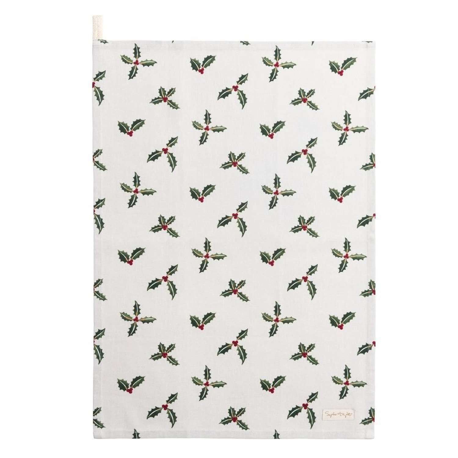 A white teatowel decorated with a repeating pattern of holly and berries.