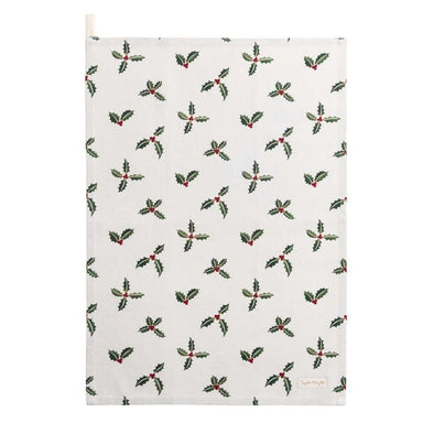 A white teatowel decorated with a repeating pattern of holly and berries.