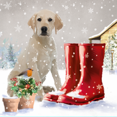 The design on this christmas card is an illustration of a yellow labrador next to a pair of red wellies and gardening tools.