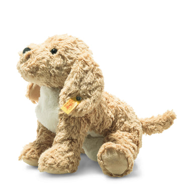 A golden coloured dog soft toy with floppy ears in a sitting down position.