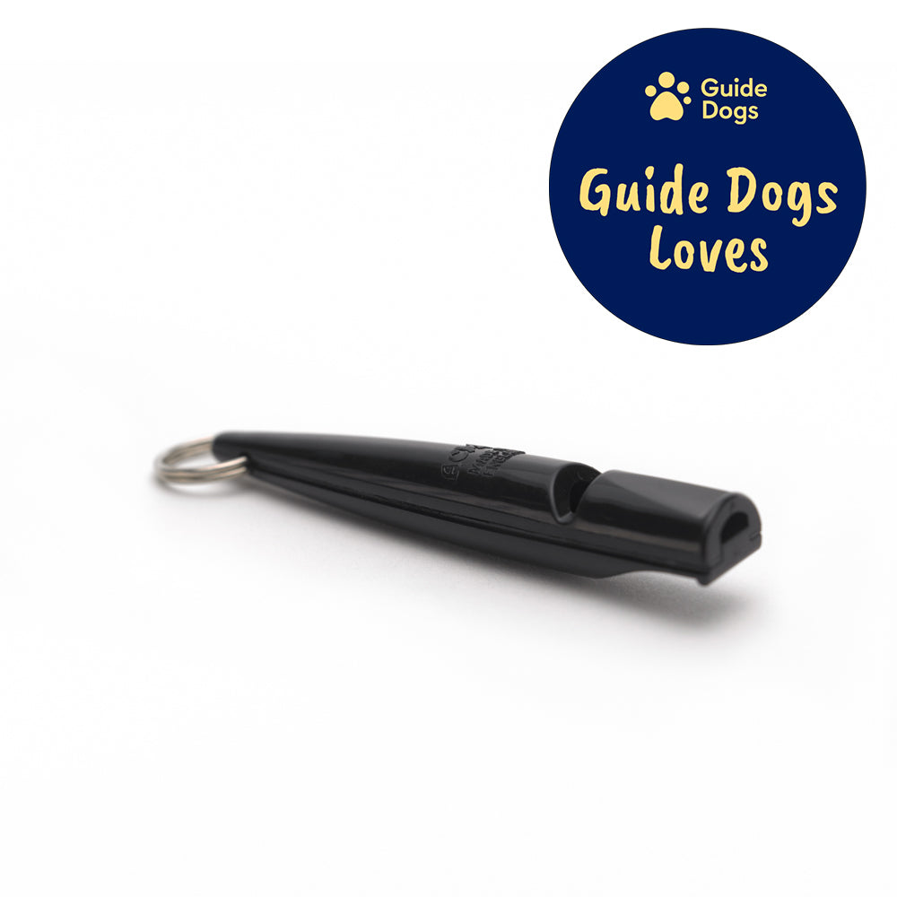 Close up of a black plastic dog whistle with a silver keyring on one end. The Guide Dogs Loves logo is in the top right.