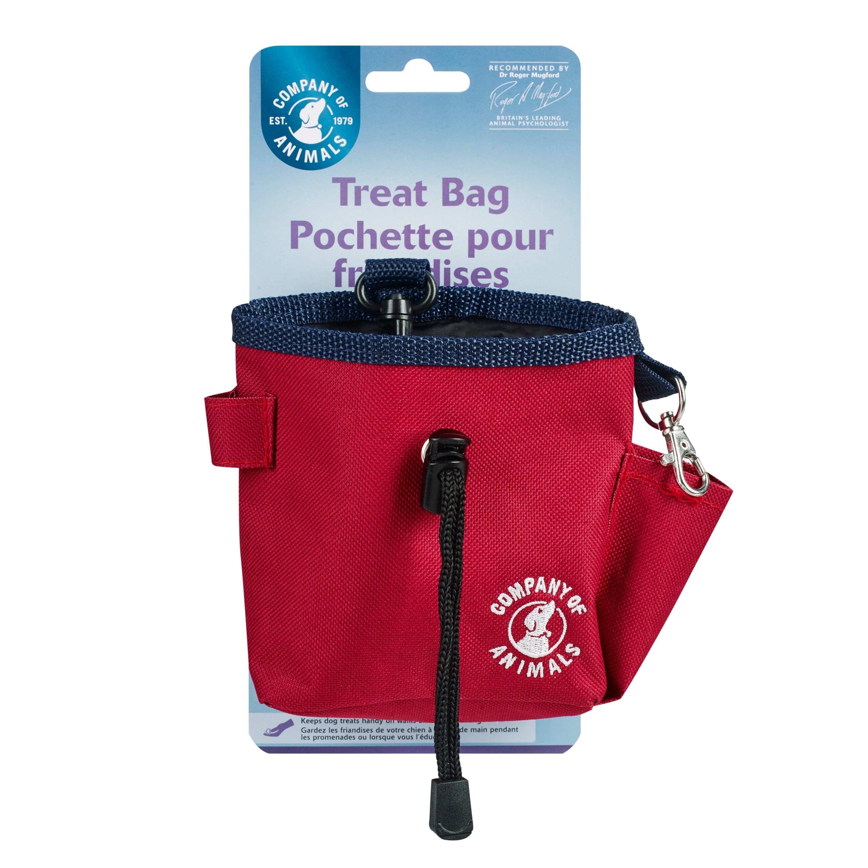 A red treat bag with a black clip and a black draw string. The Company of Animals logo is in white on the bottom right of the treat bag. The treat bag is attached to its cardboard packaging.