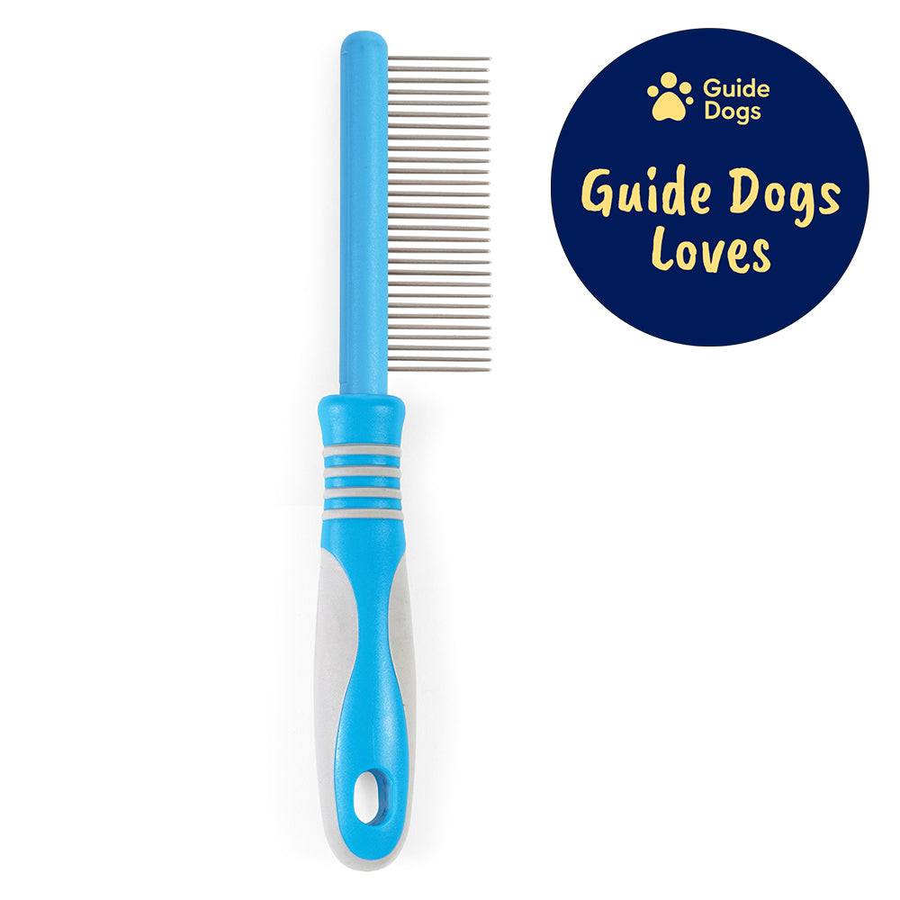 A close up of a medium comb with a blue and grey handle. The Guide Dogs Loves logo is in the top right.