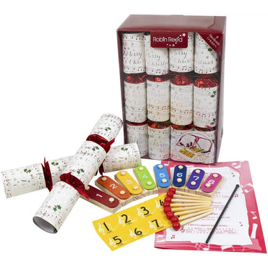 A packshot image of the Chime Christmas Crackers. In front of the box is an example of the contents. 8 chime bars, conductor baton and music sheets.