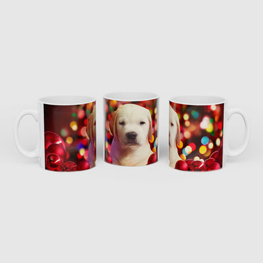 The Guide Dogs christmas mug is decorated with a Yellow Labrador Puppy surrounded by baubles and with festive lights behind. The image wraps around the outside of the white mug.