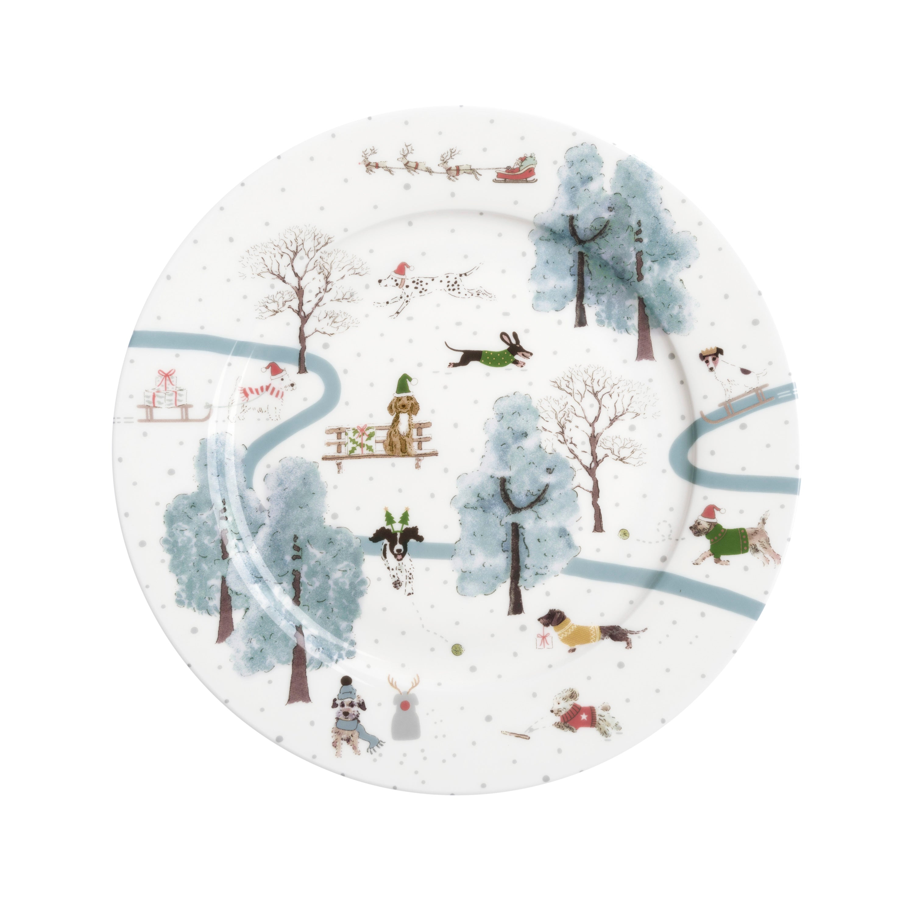 A china plate with a design of dogs in a wintry park and Father Christmas with sleigh flying overhead.
