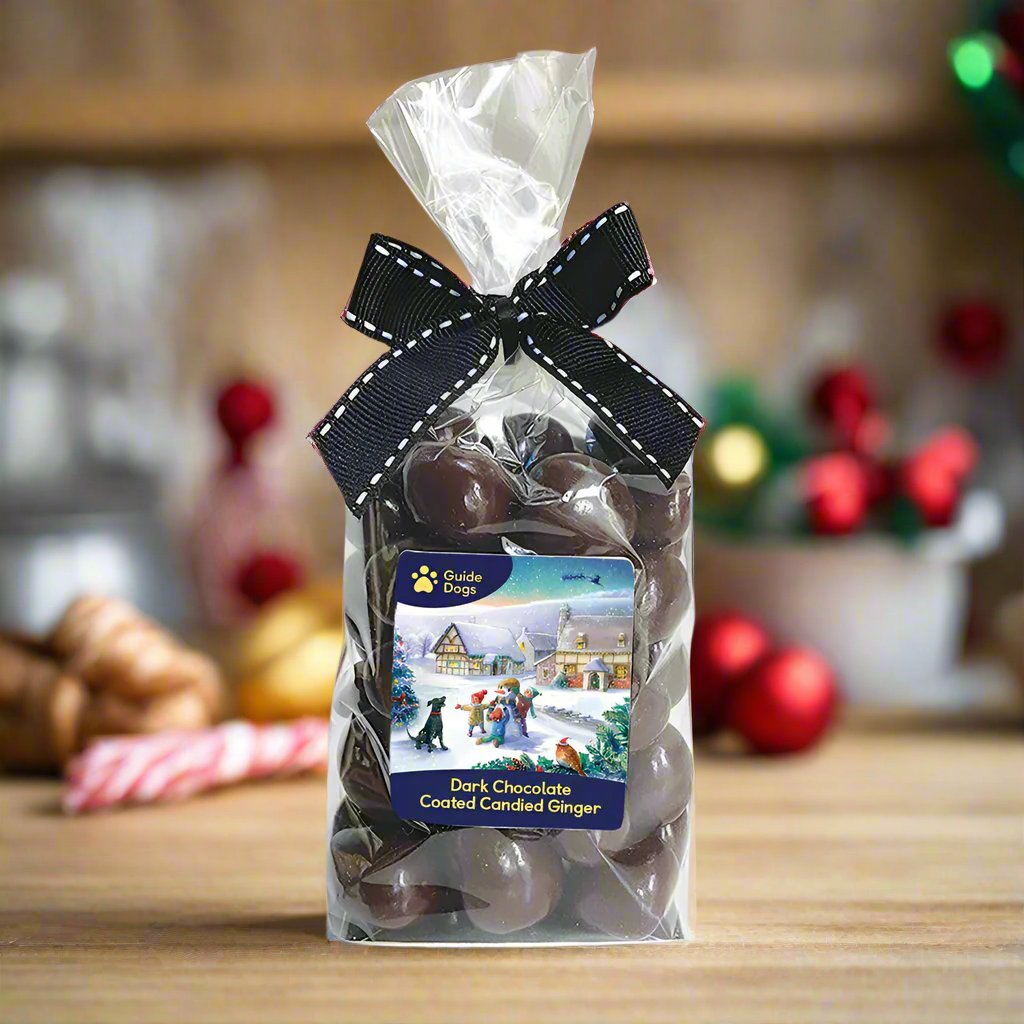 A bag of Dark Chocolate Candied Ginger is tied with a black ribbon.