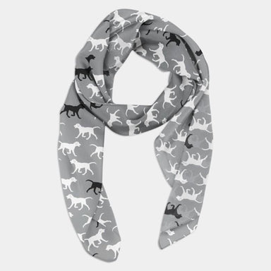 A looped grey scarf with black and white dogs pattern.