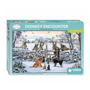 A jigsaw box with a blue border reading "Donkey Encournter". The picture on the front of the box shows a snowy scene with three dogs and two cats in a field, and five donkeys are looking over a wall at them. A robin is sitting on a snow coated stile.