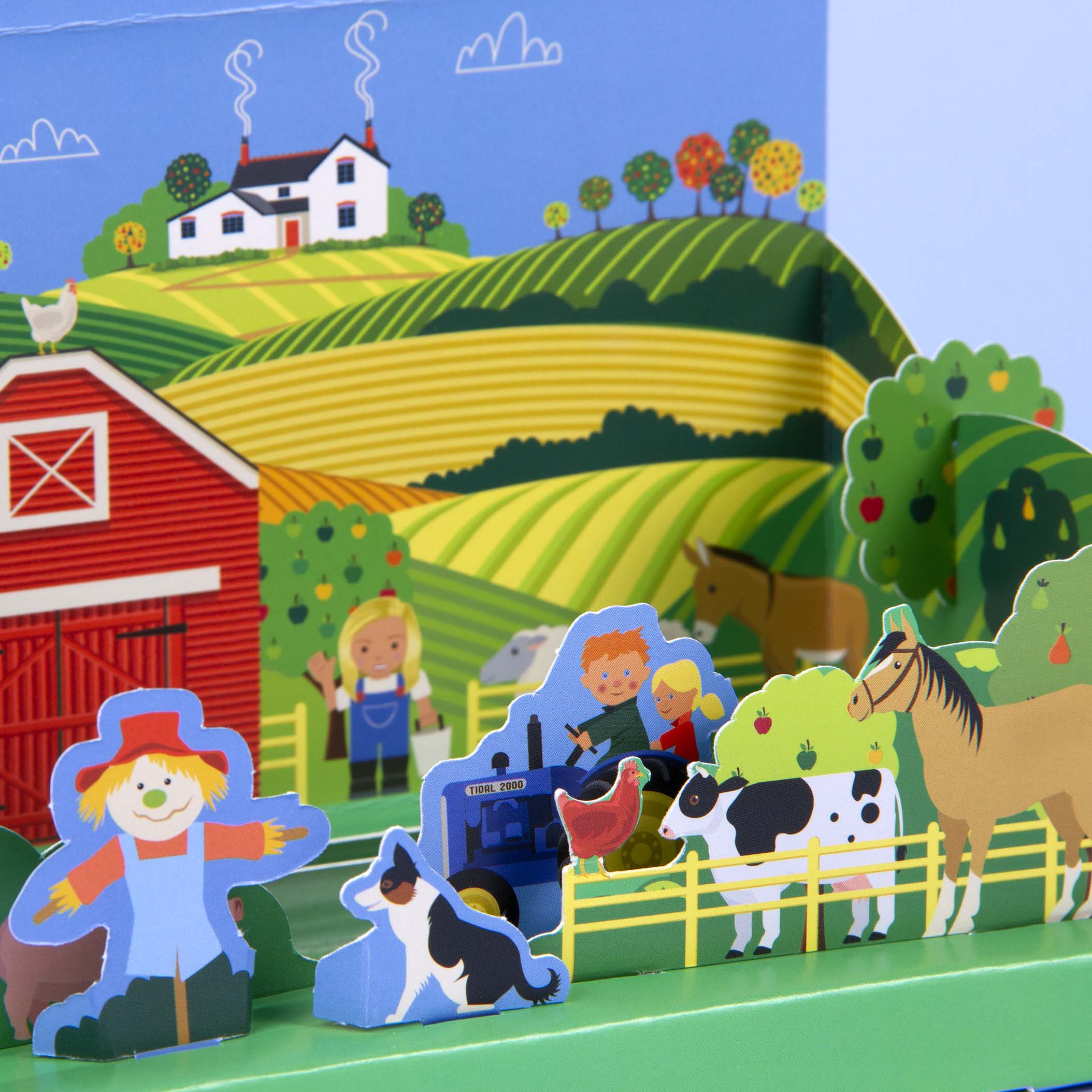 A bright and colourful close-up of a children's cardboard farmyard