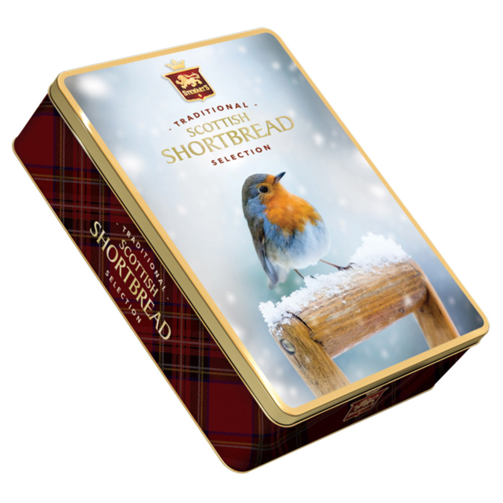 A biscuit tin with photographic design of a robin sitting on a snowy garden spade handle.