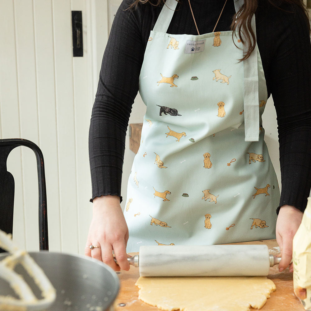 model wears laura fisher apron with puppy design
