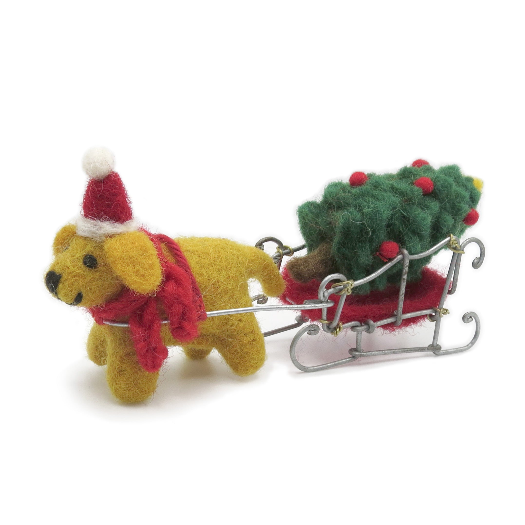 A felt golden Labrador wearing Christmas hat and scarf pulls a sleigh containing a Christmas tree