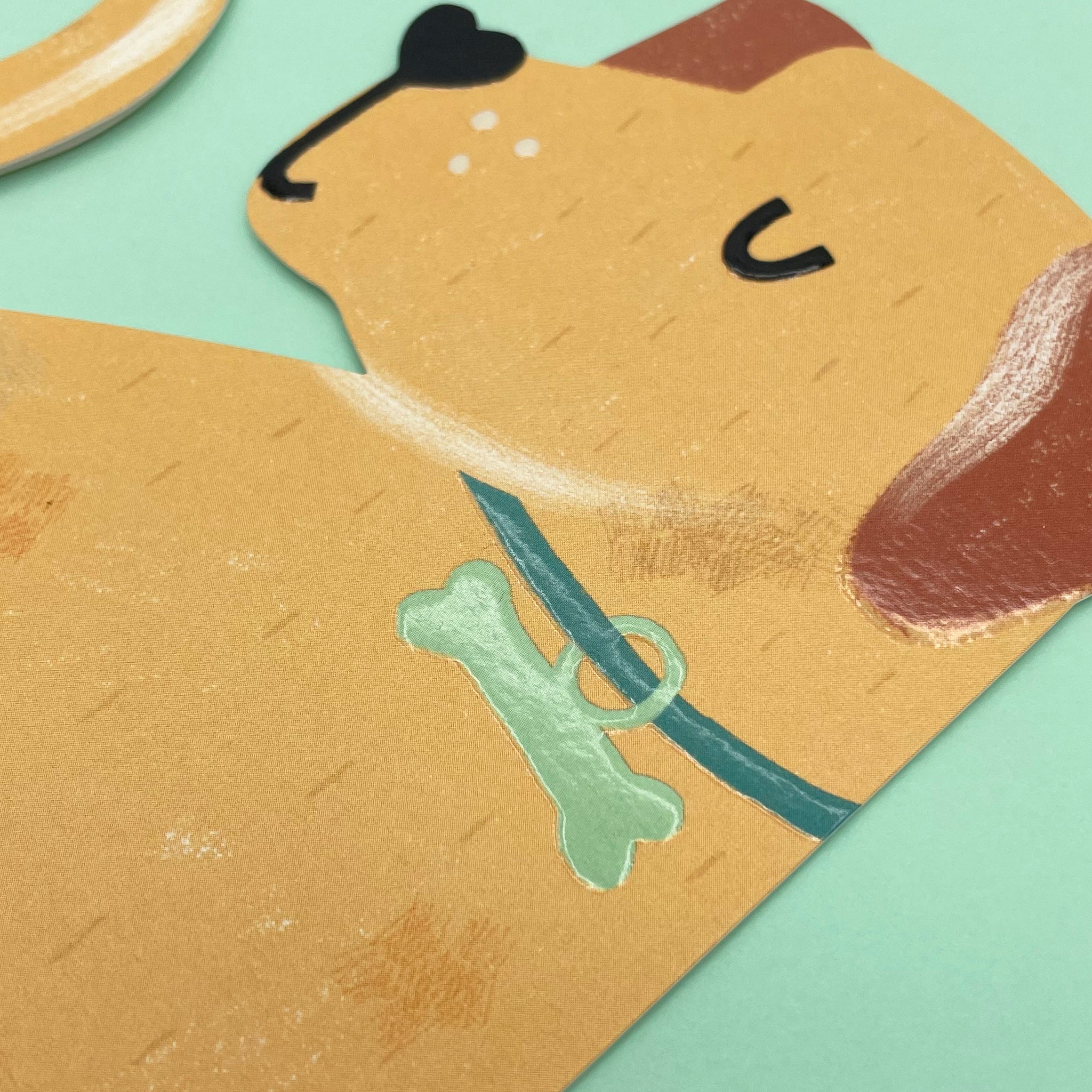 A close up of the Labrador cut out card on a mint coloured envelope.