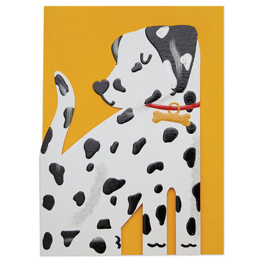 A close up of the Dalmatian cut out card on a yellow envelope.
