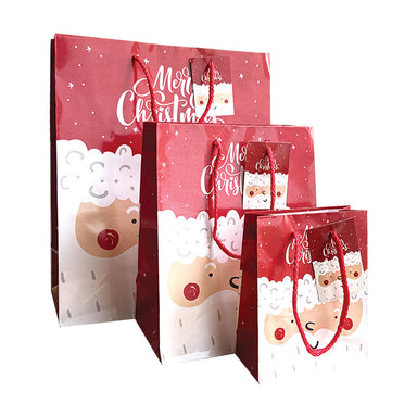 Three glossy bags in red, each with Father Christmas' face