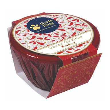 A Christmas pudding in red and gold packaging with Guide Dogs logo